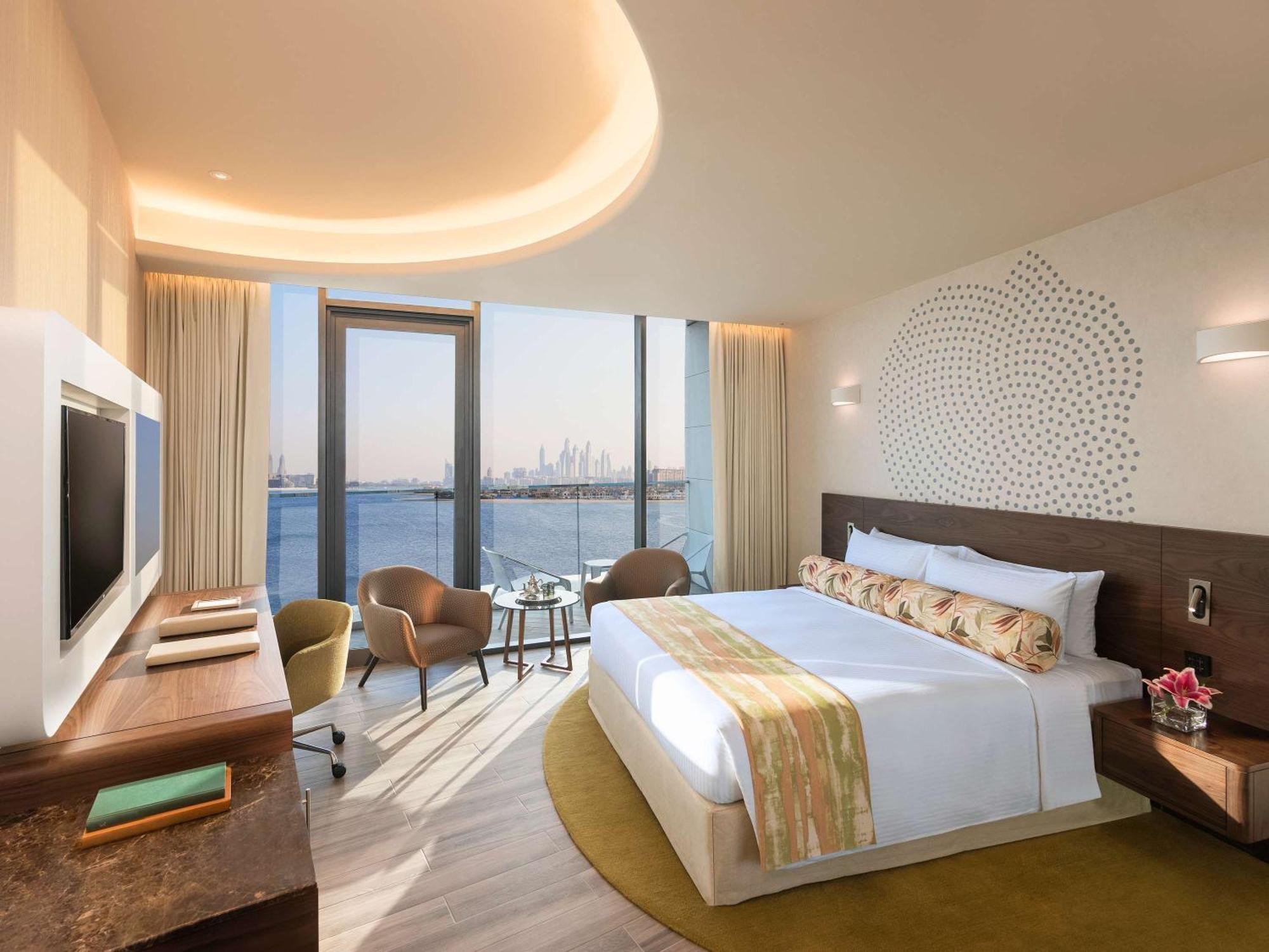 The Retreat Palm Dubai Mgallery By Sofitel Esterno foto A bedroom at the hotel